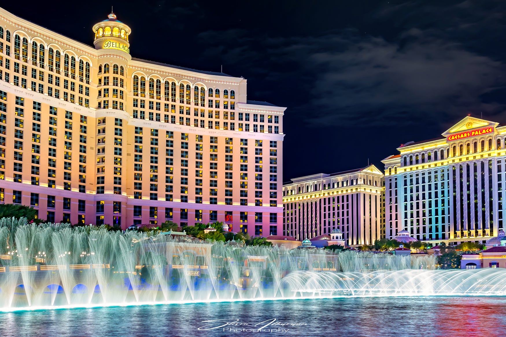 The Fountains of Bellagio at night in Las Vegas Throw Pillow